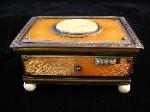 Orange enamel engine-turned with ivory trim and carved lid